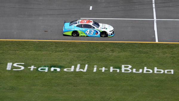 Bubba Wallace drives past the #IStandWithBubba stencil on the field prior to the NASCAR Cup Series race at the Talladega Superspeedway on June 22, 2020.