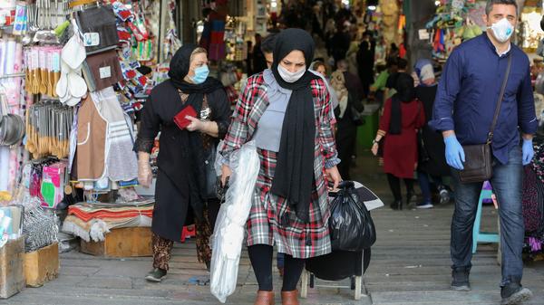 Iranians shop at the Grand Bazaar in Tehran on Monday. This week officials allowed major shopping areas to reopen, prompting a warning from Tehran's coronavirus task force.