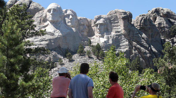 Tourists visit Mount Rushmore National Monument on Wednesday. President Trump is expected to visit the federal monument in South Dakota and give a speech before a fireworks display on Friday.