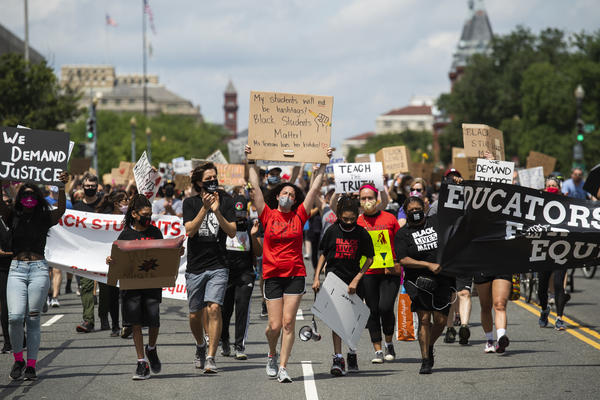 Black Students Matter demonstrators march en route to a rally at the Department of Education in Washington, D.C., on June 19.