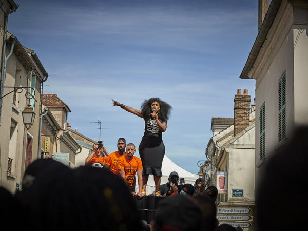 Assa Traoré addresses a crowd during a demonstration in Persan, France, to commemorate the fourth anniversary of her brother Adama Traoré's death. "The fight for justice for Adama belongs to all of France," she says.