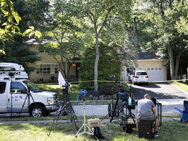 News media set up in front of the home of U.S. District Judge Esther Salas on Monday in North Brunswick, N.J. A gunman posing as a delivery person shot and killed Salas' 20-year-old son Sunday.