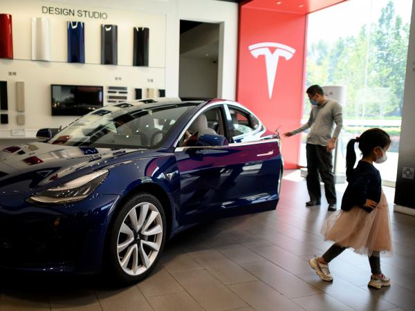 A Tesla car is on display at a showroom in Beijing on May 10. Tesla's stock has soared from $430 a share at the start of 2020 to nearly $1,600 at Wednesday's close.