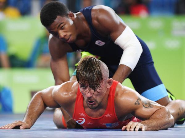 U.S. wrestler Frank Molinaro (red) battles Italy's Frank Chamizo Marquez in the 65-kg (143 pound) bronze medal bout at the 2016 Summer Olympics in Rio de Janiero.  Molinaro, who lost to Marquez, recently retired from the sport when the 2020 Olympics were postponed for a year because of the coronavirus outbreak.