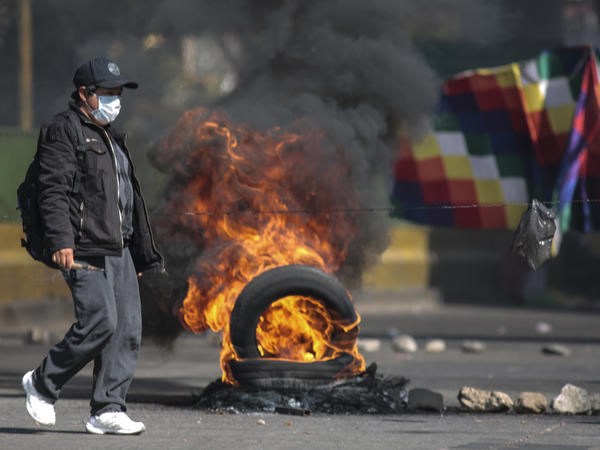 Demonstrators block roads to protest the postponement of presidential elections in El Alto, Bolivia.