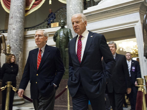 Senate Majority Leader Mitch McConnell and then-Vice President Joe Biden walk through National Statuary Hall on their way to a joint session of Congress on Jan. 6, 2017.