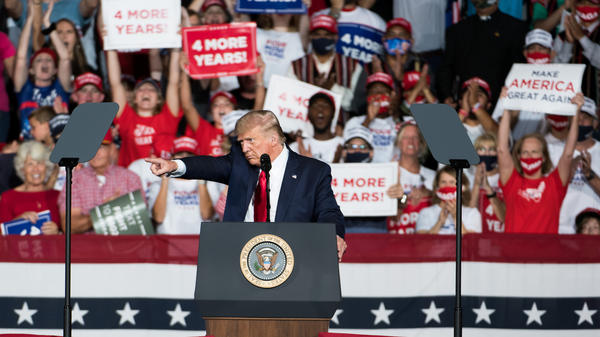 President Trump addresses the crowd during a campaign rally Tuesday at Smith Reynolds Airport in Winston Salem, N.C.