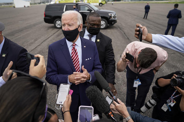 Democratic presidential nominee Joe Biden speaks to reporters before boarding his plane in Florida on Tuesday. Biden leads by 9 points against President Trump, who continues to face an uphill reelection battle.