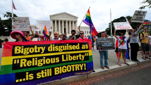 The Obama administration is set to announce expanded federal benefits for same-sex spouses, no matter what state they live in. On Thursday, demonstrators supporting same-sex marriage marched in front of the Supreme Court.