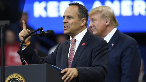 President Trump listens as Kentucky Republican Gov. Matt Bevin speaks during a campaign rally in Lexington, Ky., on Monday. Bevin is in a tight race for reelection.