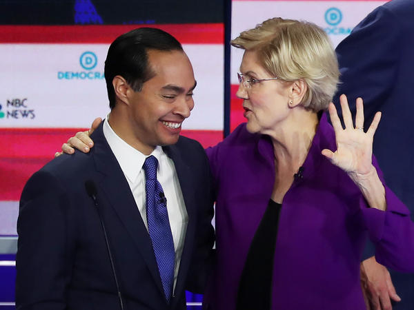 Former Housing Secretary Julián Castro and Massachusetts Sen. Elizabeth Warren embrace after a Democratic presidential debate on June 26 in Miami.