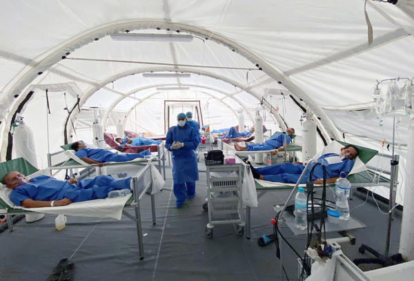 Patients are treated for COVID-19 at a field hospital in Guayaquil, Ecuador.