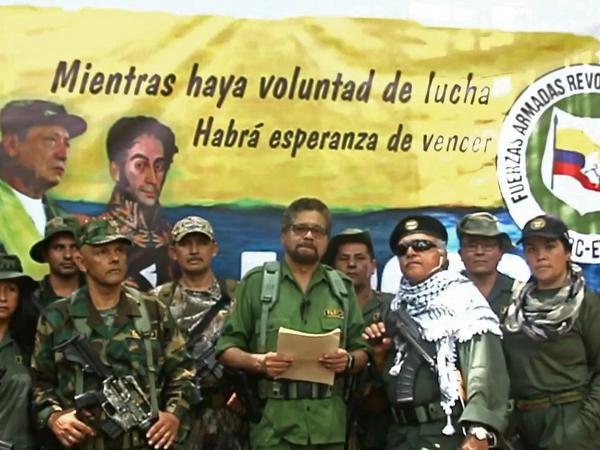 In an image from a YouTube video released on Aug. 29, 2019, shows Former senior commander Iván Márquez (center) and fugitive rebel colleague, Jesús Santrich (wearing sunglasses), of the Revolutionary Armed Forces of Colombia at an undisclosed location announcing they are taking up arms again.