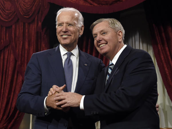 Vice President Joe Biden shares a laugh with Sen. Lindsey Graham, R-S.C., back in 2015. Graham's Judiciary Committee is beginning an investigation with links to Biden and his family.