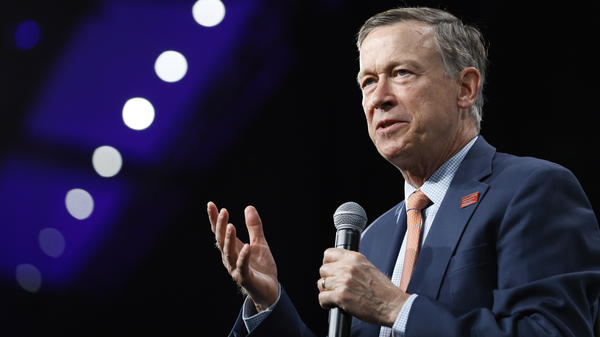 Then-Democratic presidential candidate John Hickenlooper speaks at an Iowa forum in 2019. Now the former Colorado governor is running for U.S. Senate — and locked in a battle for the Democratic primary.