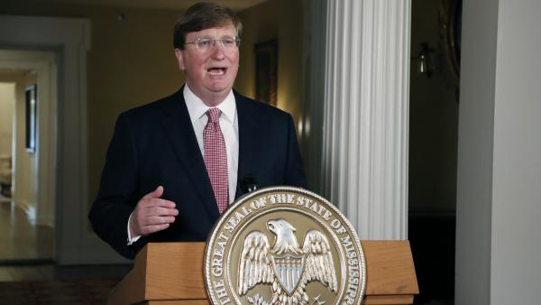 Mississippi Gov. Tate Reeves delivers a televised address prior to signing a bill retiring the last state flag in the U.S. with the Confederate battle emblem, during a ceremony at the Governor's Mansion in Jackson, Miss., on Tuesday. The legislation passed both chambers of the Legislature on Sunday.