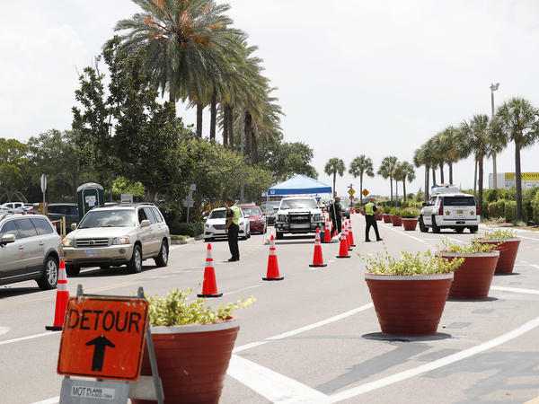 Cars line up for drive-through coronavirus testing in St. Petersburg, Florida. The state reported a record-breaking 15,299 new cases on Sunday.