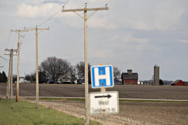 A road sign for a nearby hospital along a rural road outside Sandwich, Ill., in April.