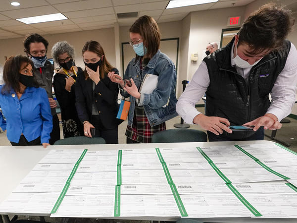 Democratic and Republican canvas observers inspect Lehigh County provisional ballots as vote counting in the general election continued on Friday.