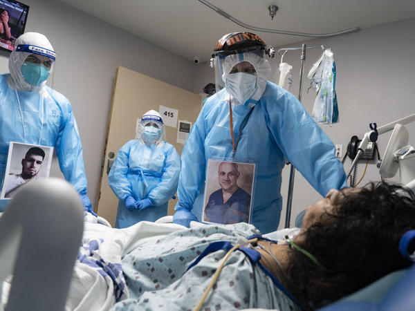 Medical staff members check on a patient at the COVID-19 ICU in United Memorial Medical Center in Houston, Texas. Cases and hospitalizations rose dramatically in the U.S. this week.