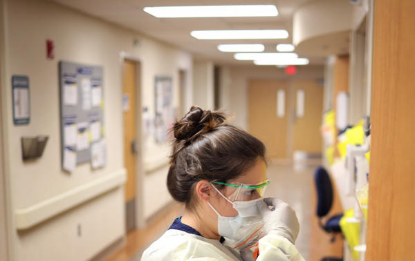 Nurses in the intensive care unit of MedStar St. Mary's Hospital check the fit of protective equipment before entering a patient's room March 24, 2020 in Leonardtown, Maryland. (Win McNamee/Getty Images)
