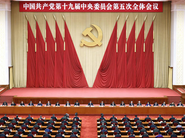 Chinese President Xi Jinping, center, also general secretary of the Chinese Communist Party, leads the fifth plenary session of the party's 19th Central Committee in October in Beijing. The U.S. State Department on Thursday tightened travel restrictions on members of the party and their families.
