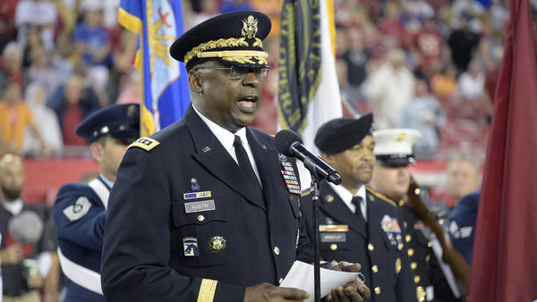 Gen. Lloyd Austin addresses military recruits during an induction ceremony in Tampa, Fla., in 2015.