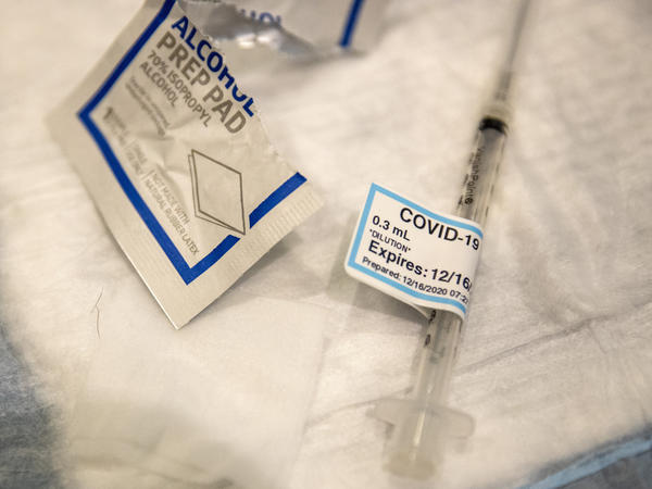 An empty syringe on a table at Ronald Reagan UCLA Medical Center after a care worker received the COVID-19 vaccine on Dec. 16, 2020.