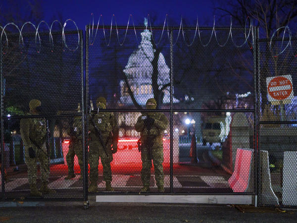National Guard troops reinforce the security zone on Capitol Hill in Washington early Tuesday, before President-elect Joe Biden is sworn in as the 46th president on Wednesday.