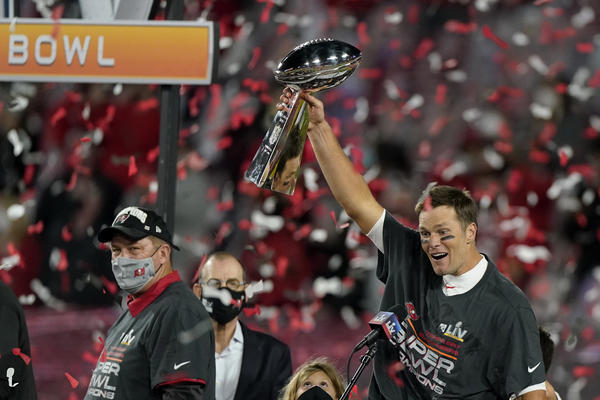 Quarterback Tom Brady celebrates with the Vince Lombardi Trophy after leading the Tampa Bay Buccaneers to Super Bowl victory against the Kansas City Chiefs on Sunday.