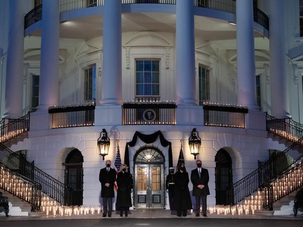 President Biden, first lady Jill Biden, Vice President Harris and second gentleman Doug Emhoff hold a moment of silence and candlelight ceremony in honor of those who have lost their lives to the coronavirus.