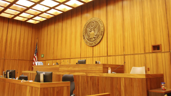 A U.S. federal courtroom sits empty in 2017 in Honolulu. A new study finds that judges with backgrounds as prosecutors or corporate lawyers are more likely to rule in favor of employers.