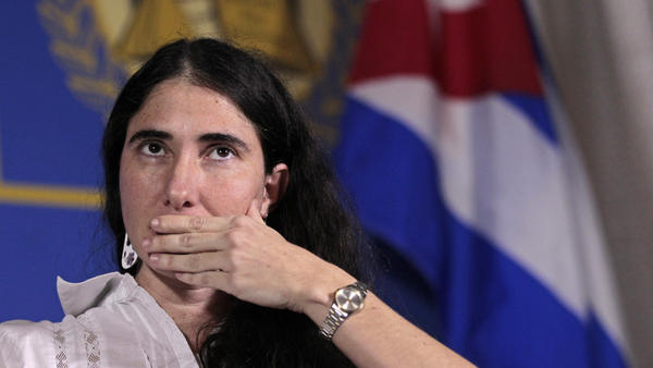 Yoani Sanchez, internationally known dissident blogger from Cuba, listens to a question as she speaks at the Freedom Tower in Miami on Monday.