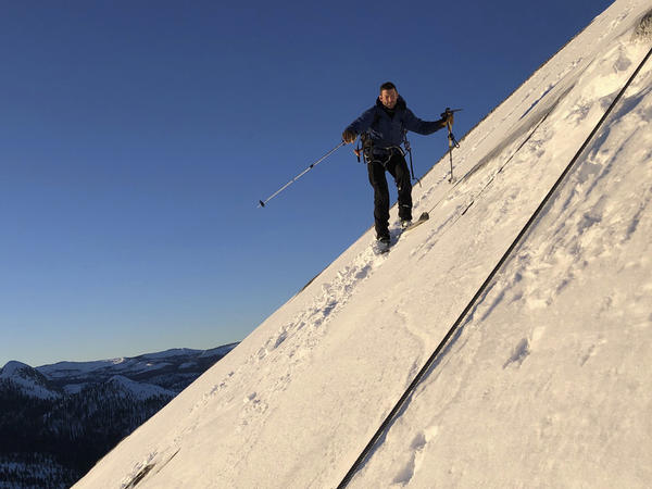 In this photo provided by Jason Torlano, Zach Milligan is shown on his descent down Half Dome in Yosemite National Park, Calif., on Feb. 21. The two men climbed some 4,000 feet to the top of Yosemite's Half Dome in subfreezing temperatures and skied down the famously steep monolith to the valley floor.