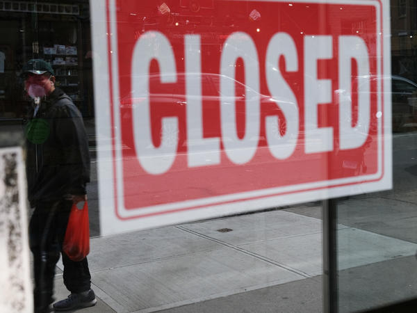 A store in New York City stands closed on April 21, 2020. A year after the pandemic started to spread, millions of Americans are still unemployed.