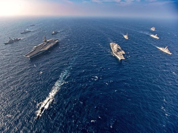 Aircraft carriers and warships participate in the second phase of Malabar naval exercise, a joint exercise by India, the U.S., Japan and Australia, in the northern Arabian Sea last November. The four countries form the Quadrilateral Security Dialogue, or the Quad.