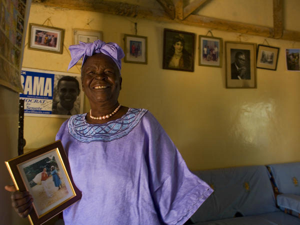 Sarah Obama holds a photograph of her grandson, Barack Obama in Kogelo, Kenya while awaiting the results of Super Tuesday's primary in Feb. 2008. She died on Monday after a brief illness, and is being remembered as a beloved matriarch and philanthropist.