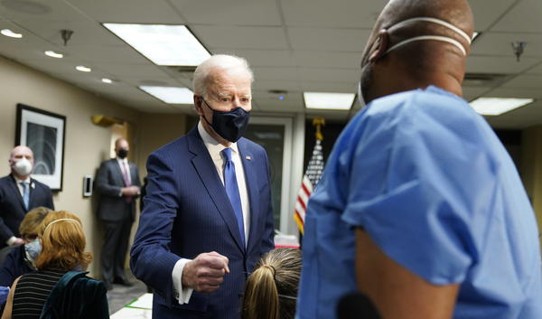President Biden talks to recently vaccinated Army Staff Sgt. Marvin Cornish as he visits a COVID-19 vaccination site at the VA Medical Center in Washington, D.C., on Monday.