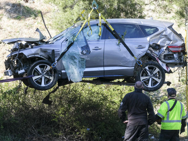 A crane is used to lift a vehicle driven by golfer Tiger Woods following a rollover accident in February in the Rancho Palos Verdes suburb of Los Angeles.