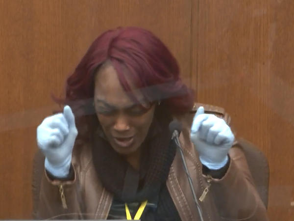 Shawanda Hill testifies Tuesday in the trial of Derek Chauvin. She said that as a police officer stood with a gun drawn outside the car she was in with George Floyd, Floyd grabbed the steering wheel and started saying, "Please, please don't kill me, please, please don't shoot me."