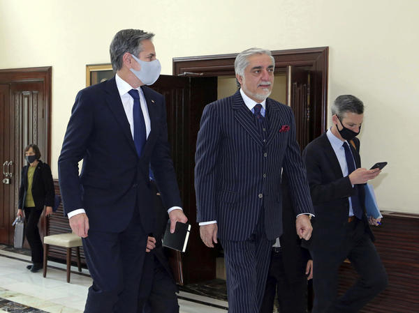 Abdullah Abdullah (center), chairman of the High Council for National Reconciliation, accompanies U.S. Secretary of State Antony Blinken at the Sapidar Palace in Kabul, Afghanistan, on Thursday.