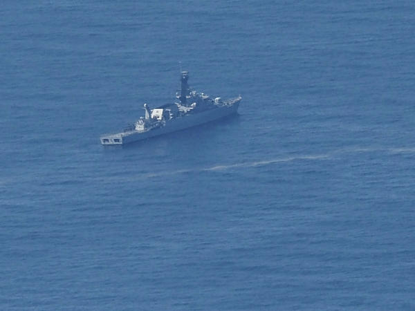 An Indonesian navy ship searches for the submarine KRI Nanggala 402 that went missing this week in the waters off Bali.