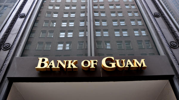 Dozens of people in Micronesia are suing the Bank of Guam for seizing stimulus checks they deposited. The bank did so to help the IRS recover tax payments issued in error.