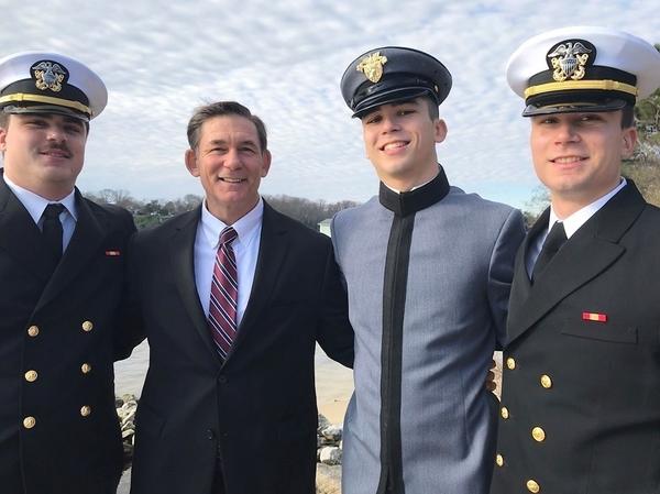 Jeff Nelligan (center left) stands with his three sons in December 2019.