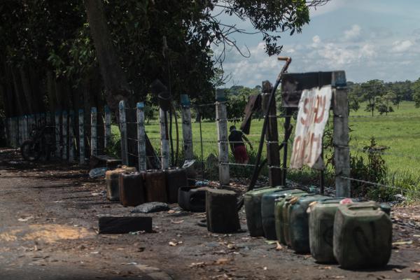 Contraband fuel sits on the side of a road in Puerto Santander, Colombia, on May 31, 2019. The Venezuelan government's lack of cash to import gasoline combined with U.S. sanctions targeting the oil sector have led to chronic fuel shortages in Venezuela. That has upended a long-running, lucrative contraband gas trade.