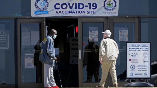 A COVID-19 vaccination clinic last month in Auburn, Maine. A drop in life expectancy in the U.S. stems largely from the coronavirus pandemic, a new study says.