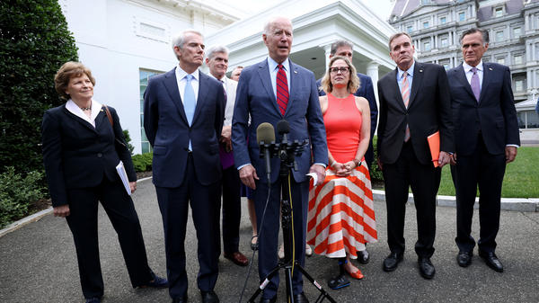 President Biden speaks outside the White House with a bipartisan group of senators after meeting on infrastructure Thursday.