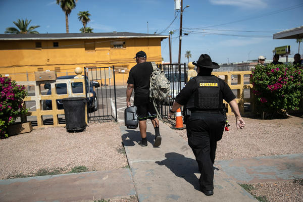 Maricopa County constable Darlene Martinez evicts a tenant on October 7, 2020 in Phoenix, Arizona. Thousands of court-ordered evictions continue nationwide despite a Centers for Disease Control (CDC) moratorium for renters impacted by the coronavirus pandemic.