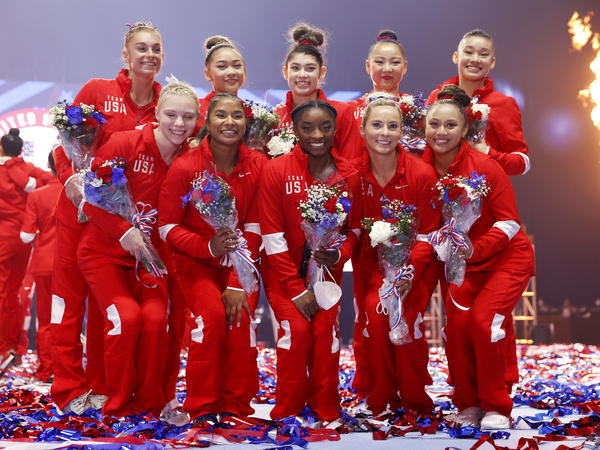 The women representing Team USA, including six team members and four alternates, pose last month after the U.S. Gymnastics Olympic trials in St. Louis. Kara Eaker, an alternate, has tested positive for the coronavirus, her gym says.
