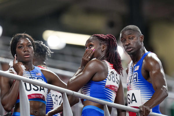 U.S. sprinter Lynna Irby wipes away a tear Friday after the 4x400-meter mixed relay at the Tokyo Olympics.